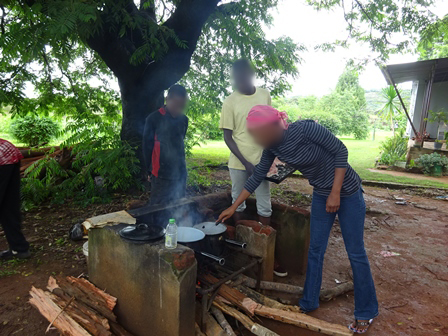 Children cooking on open fire